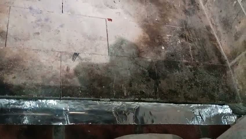 Soot buildup inside a fireplace before cleaning